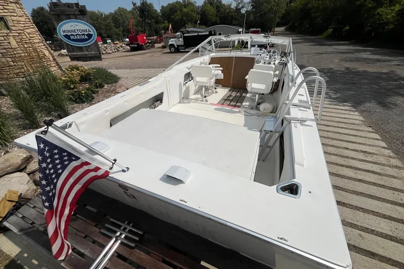 Slide: The Image of 1975 Bertram 26 Moppie boat at Minnetonka Marina with American flag. - 9
