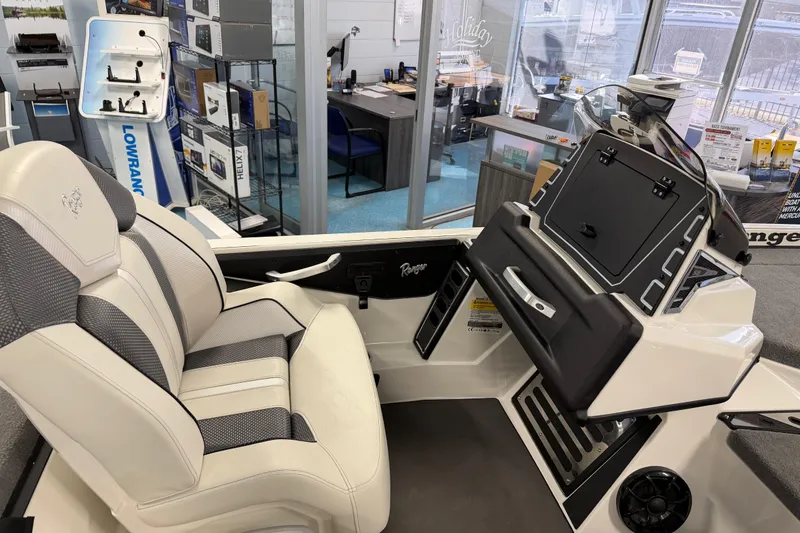 Slide: The Image of 2026 Ranger Z519 boat interior with sleek seating and modern dashboard design. - 17