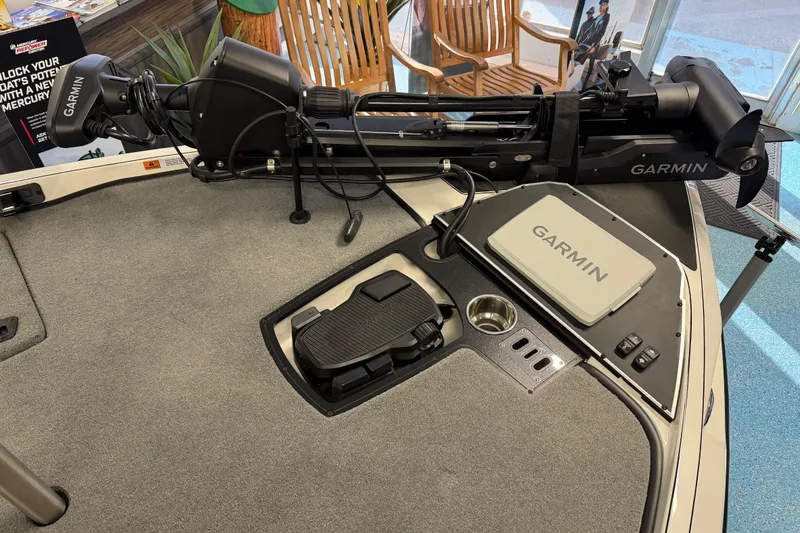 Slide: The Image of 2026 Ranger Z519 boat deck with Garmin equipment and foot pedal controls. - 21