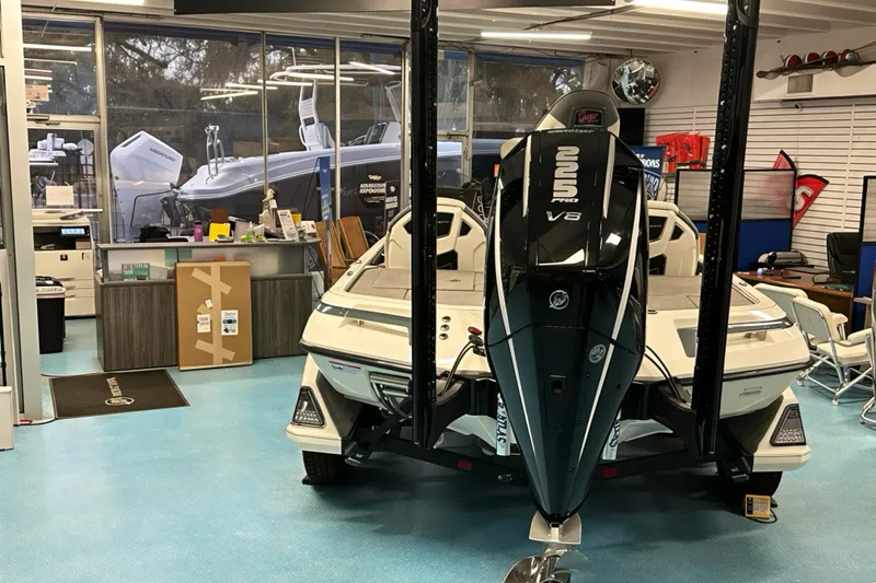 Slide: The Image of 2026 Ranger Z519 boat with V8 engine displayed in a showroom. - 24
