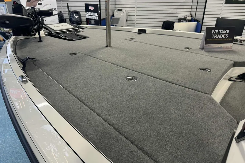 Slide: The Image of 2026 Ranger Z519 boat interior with dual seats and modern dashboard in showroom. - 5