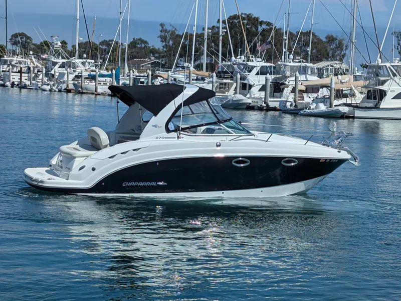 Slide: The Image of 2011 Chaparral Signature 270 boat docked in a marina. - 13