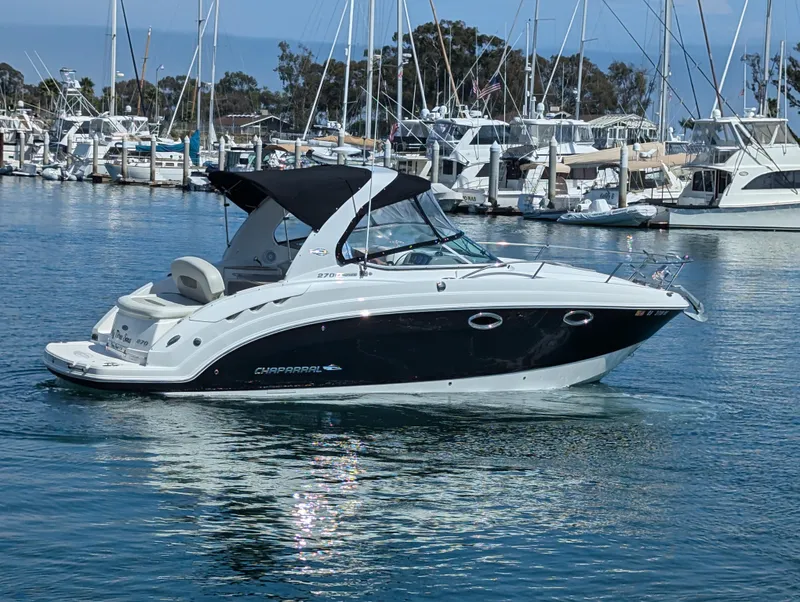 Slide: The Image of 2011 Chaparral Signature 270 boat docked in a marina. - 16