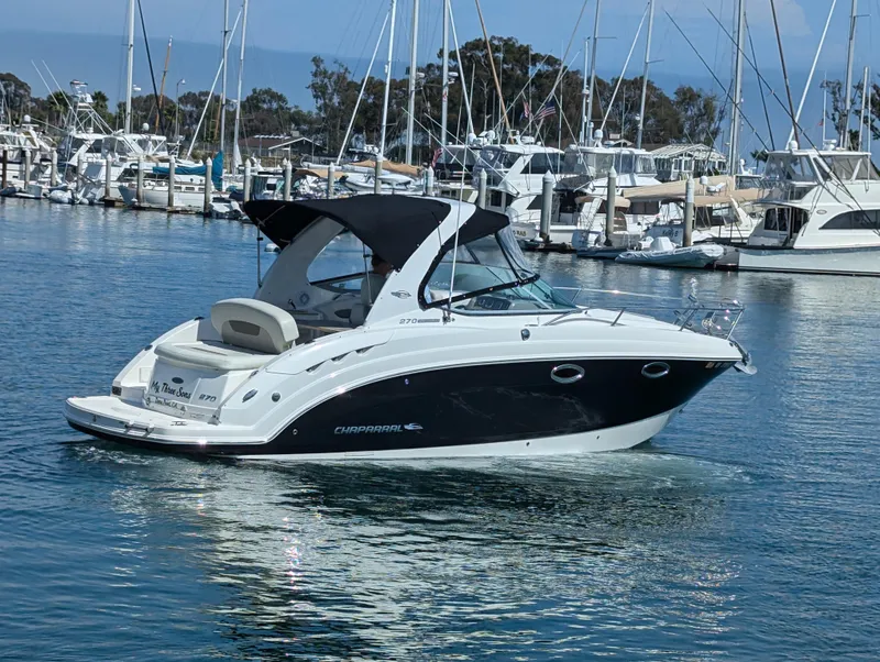 Slide: The Image of 2011 Chaparral Signature 270 boat docked in a marina. - 21
