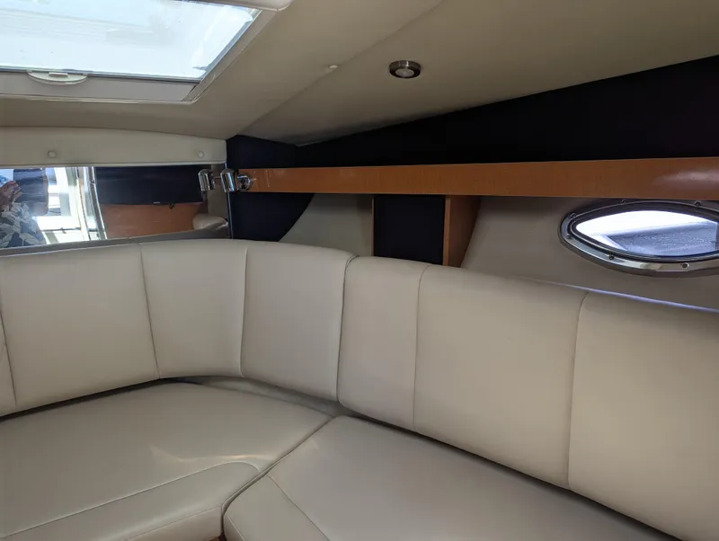 Slide: The Image of Interior cabin of 2011 Chaparral Signature 270 with beige leather seating. - 33