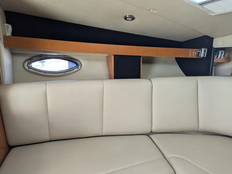 Slide: The Image of Interior of 2011 Chaparral Signature 270 boat with beige leather seating. - 35