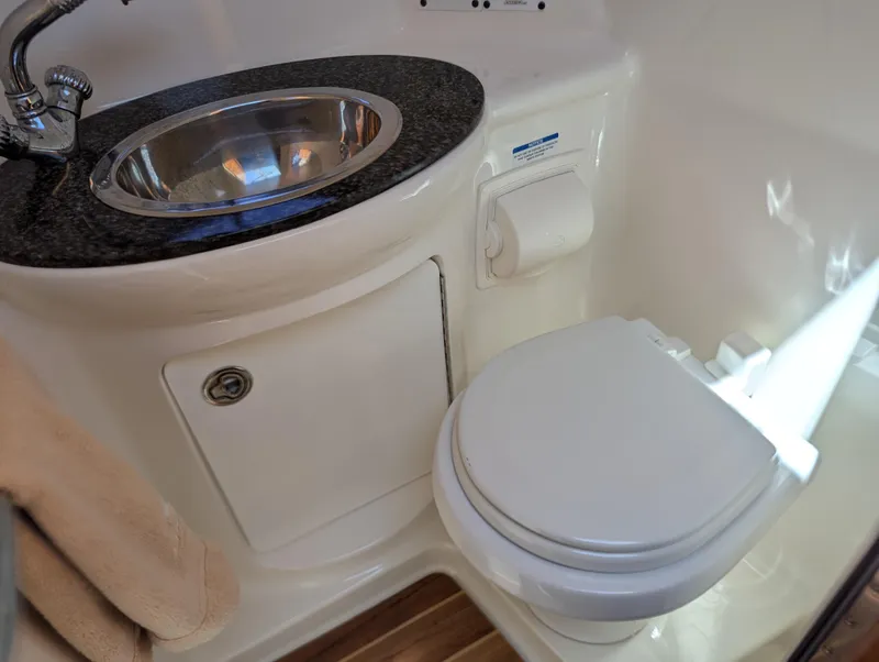 Slide: The Image of 2011 Chaparral Signature 270 boat bathroom with sink and toilet - 38