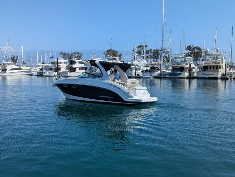 Slide: The Image of 2011 Chaparral Signature 270 boat in a marina with other yachts. - 5