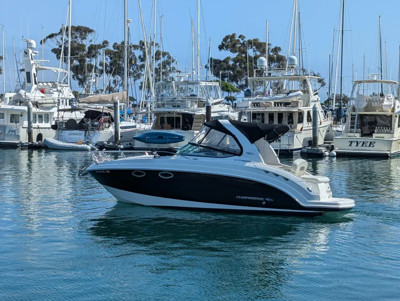 Slide: The Image of 2011 Chaparral Signature 270 boat in a marina with other yachts. - 8