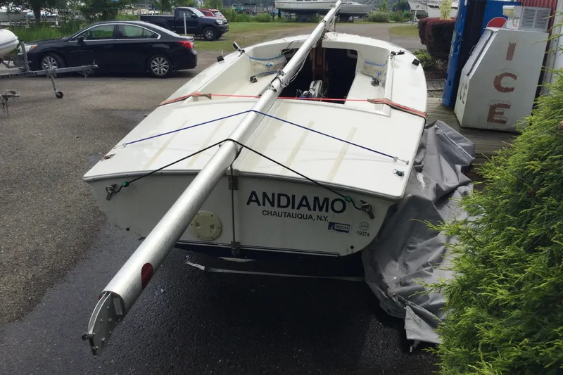Slide: The Image of Flying Scot 19 sailboat, 2002 model, docked with mast secured, labeled "Andiamo" in Chautauqua, NY. - 1