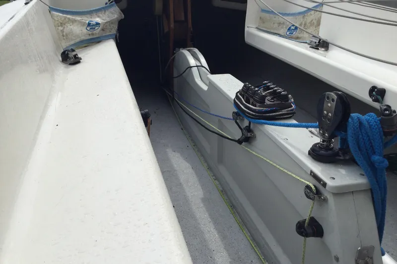 Slide: The Image of Interior view of a 2002 Flying Scot 19 sailboat, showcasing rigging and deck details. - 6