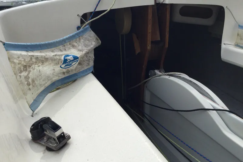 Slide: The Image of Interior view of a 2002 Flying Scot 19 sailboat, showing rigging and storage. - 7