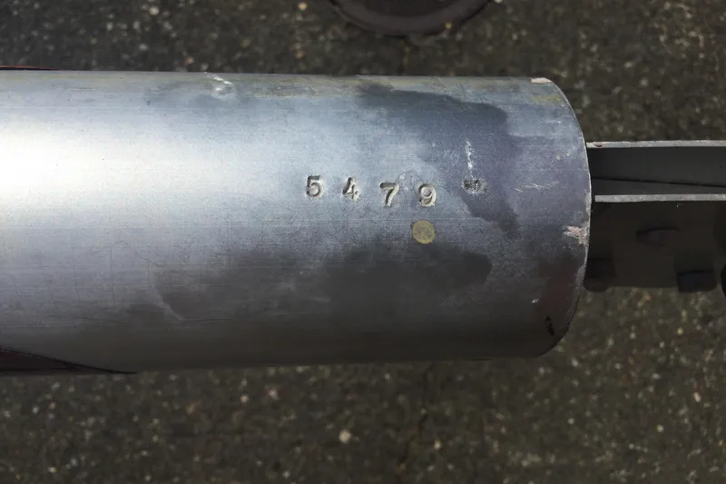 Slide: The Image of Close-up of a metal pipe with the number "5479" engraved, Flying Scot 19, 2002 model. - 9