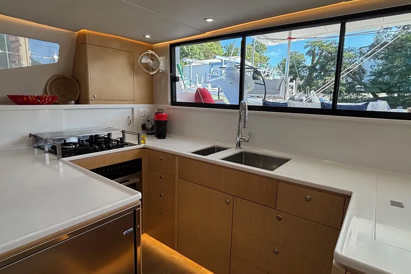 Slide: The Image of Modern kitchen interior of 2022 Seawind 1600 yacht with sleek countertops and appliances. - 17