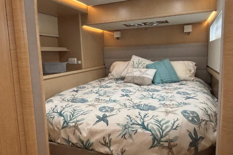 Slide: The Image of Cozy bedroom in 2022 Seaway 1600 boat with nautical-themed bedding and soft lighting. - 18