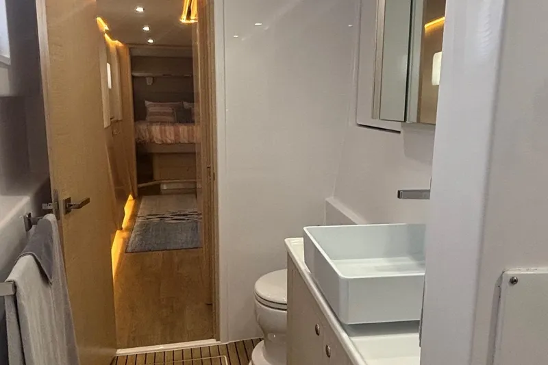 Slide: The Image of Modern bathroom interior on 2022 Seaway 1600 yacht, featuring sleek design and ambient lighting. - 21