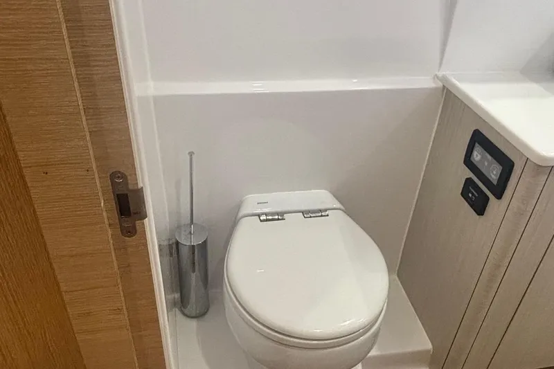 Slide: The Image of Modern bathroom in 2022 Seaway 1600 with sleek toilet and wooden accents. - 27