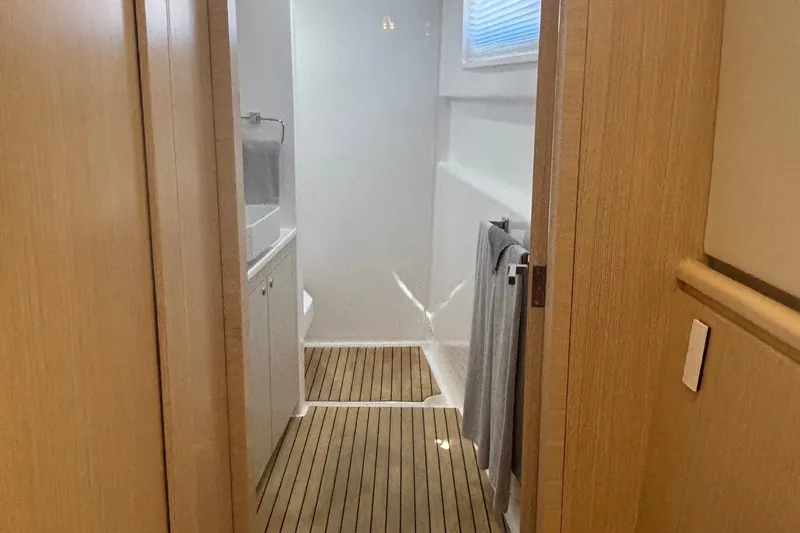 Slide: The Image of Modern bathroom interior on 2022 Seaway 1600 yacht with wooden flooring and sleek design. - 28