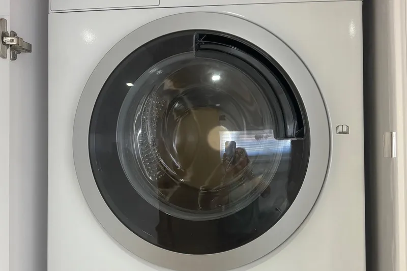 Slide: The Image of Front view of a 2022 Seaway 1600 washing machine with a circular door. - 30
