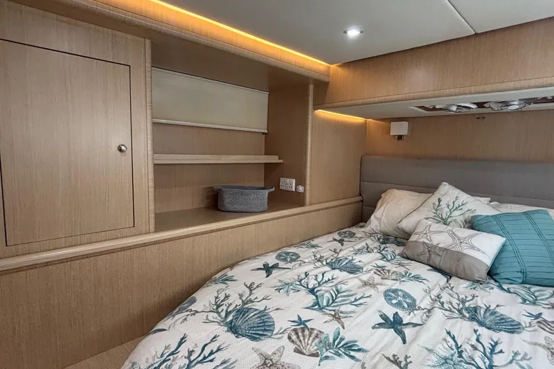Slide: The Image of Luxurious 2022 Seaway 1600 cabin interior with cozy bedding and elegant wood finish. - 39