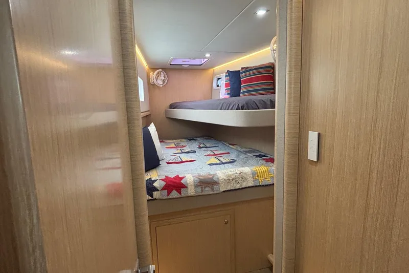Slide: The Image of Cozy cabin interior of 2022 Seaway 1600 with bunk beds and nautical-themed decor. - 42