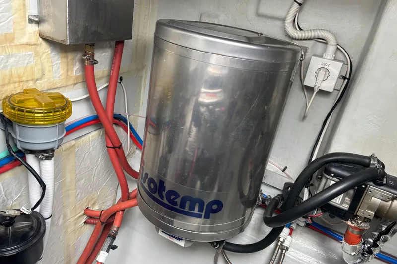 Slide: The Image of Seaway 1600 (2022) engine room with Isotemp water heater and wiring. - 55
