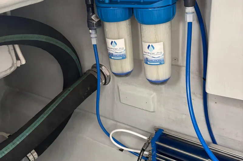 Slide: The Image of 2022 Seaway 1600 water filtration system with dual filters and blue tubing. - 59
