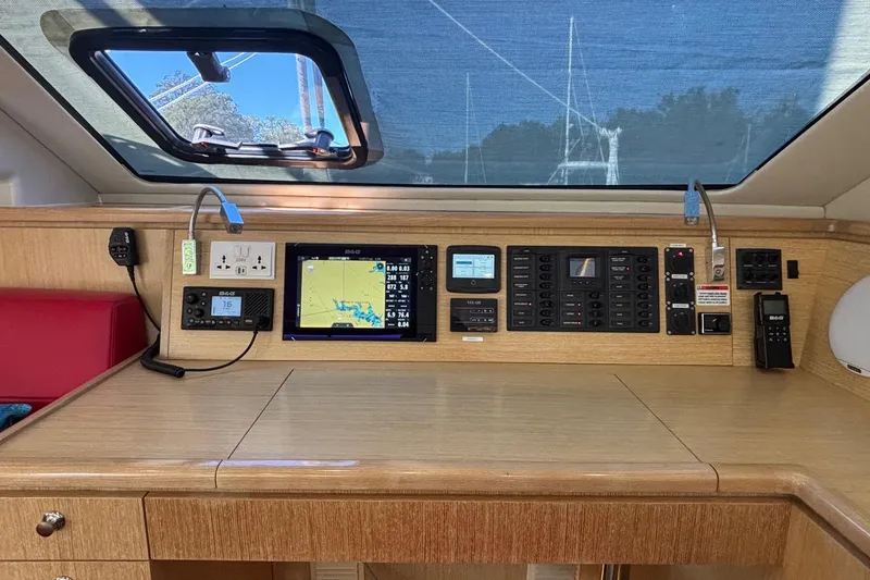 Slide: The Image of Interior of 2022 Seawind 1600 yacht with navigation equipment and control panel. - 7