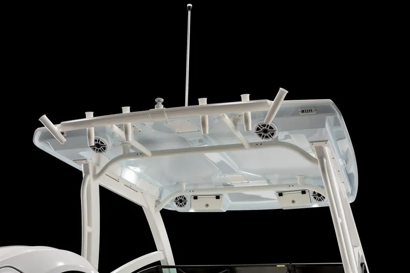Slide: The Image of 2026 Robalo R257 Dual Console boat top with rod holders and speakers. - 11