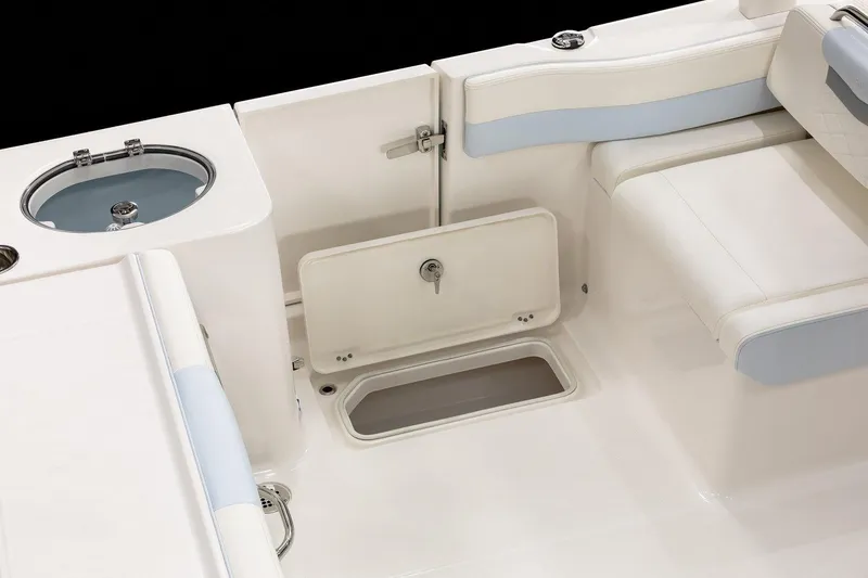 Slide: The Image of 2026 Robalo R257 Dual Console boat interior with storage compartments and seating. - 17