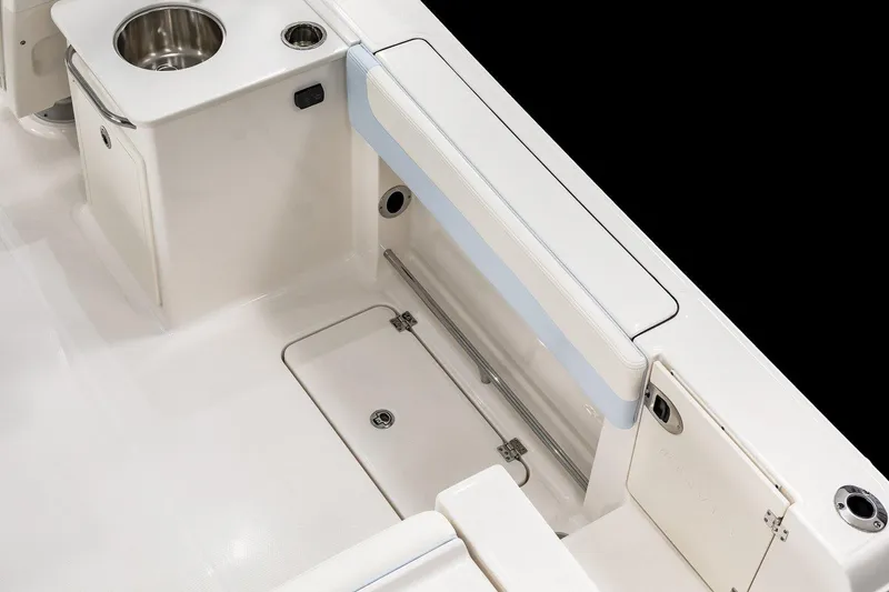 Slide: The Image of 2026 Robalo R257 Dual Console boat interior with seating and storage compartments. - 23