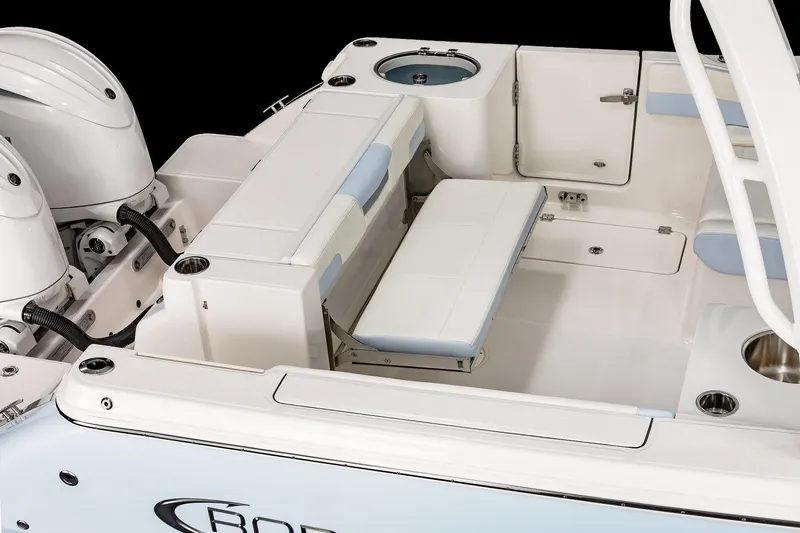 Slide: The Image of 2026 Robalo R257 Dual Console boat interior with seating and storage compartments. - 24