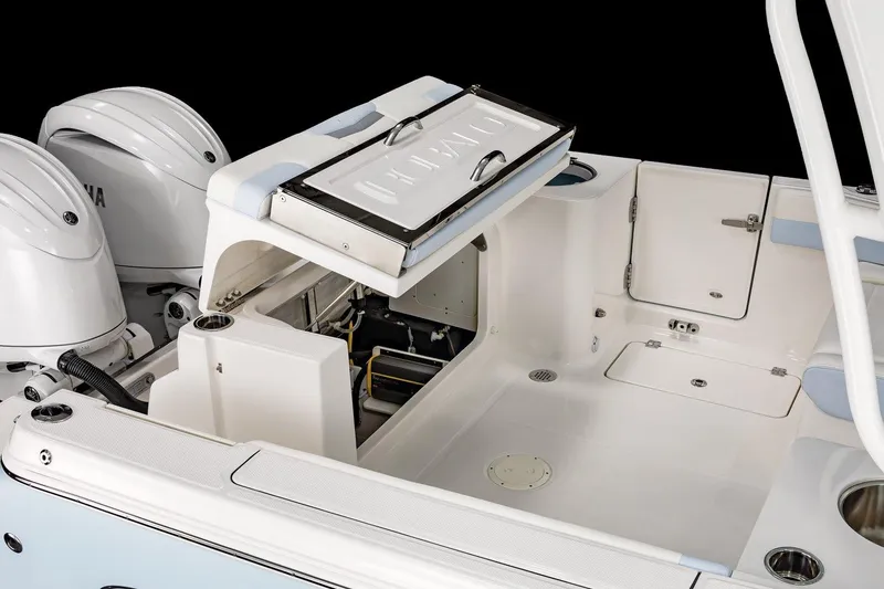 Slide: The Image of 2026 Robalo R257 Dual Console boat interior with open storage compartments. - 26