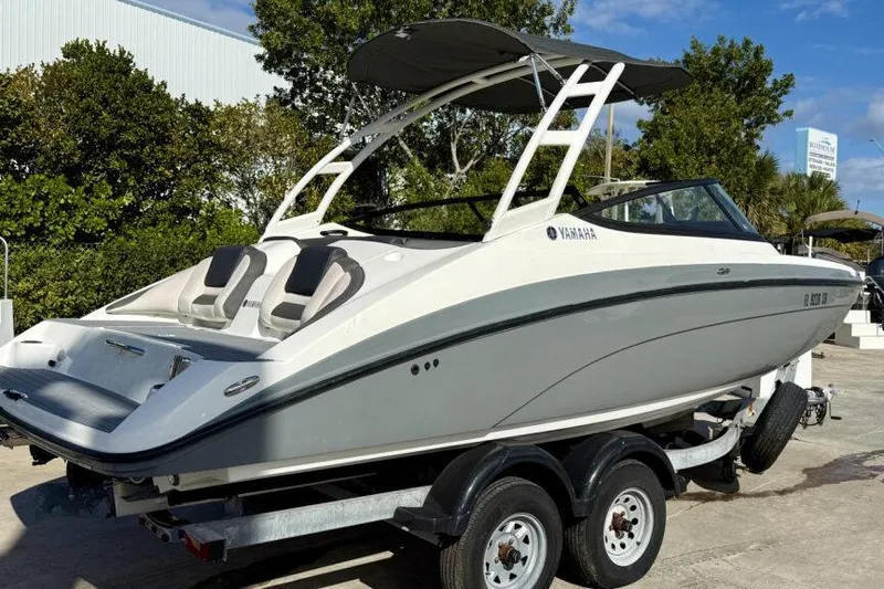 Slide: The Image of 2020 Yamaha Boats AR210 on trailer, sleek design, outdoor setting. - 12