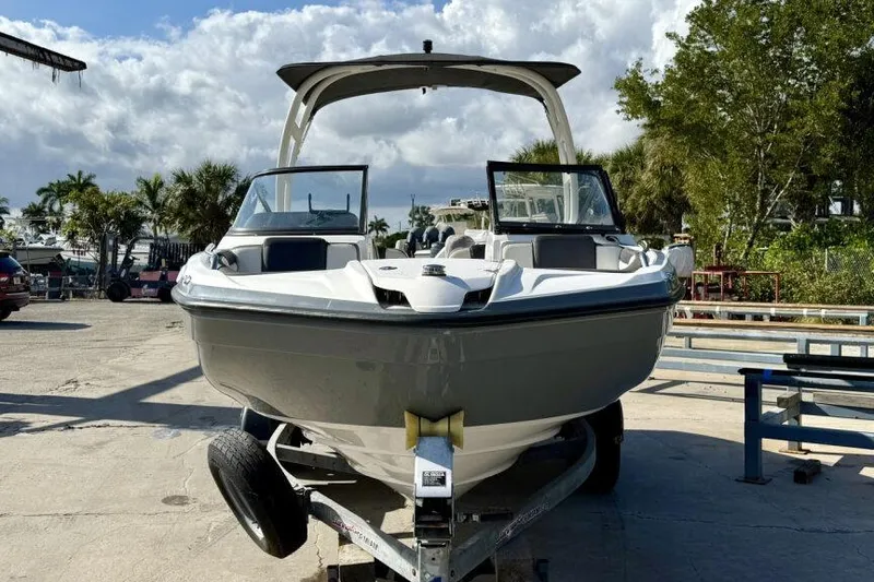 Slide: The Image of 2020 Yamaha Boats AR210 on trailer, parked outdoors under cloudy sky. - 16