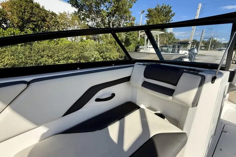 Slide: The Image of 2020 Yamaha AR210 boat interior with cushioned seating and sleek design. - 22