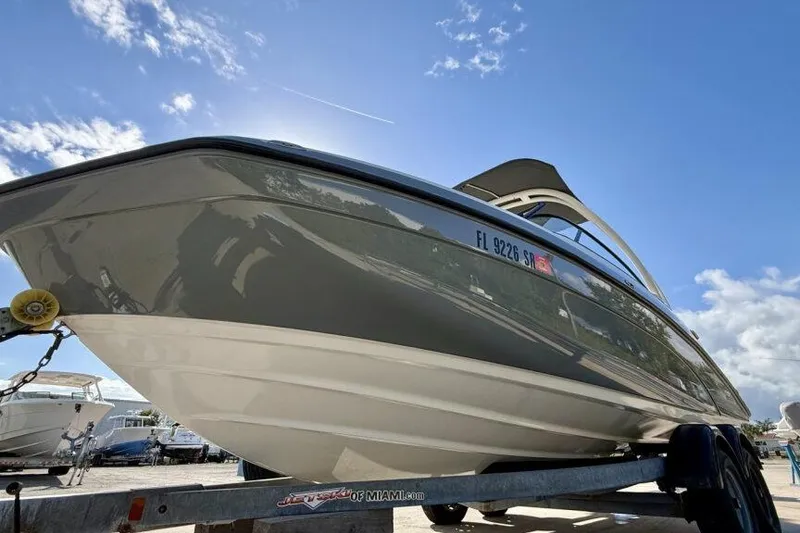Slide: The Image of 2020 Yamaha Boats AR210 on trailer under clear blue sky. - 29