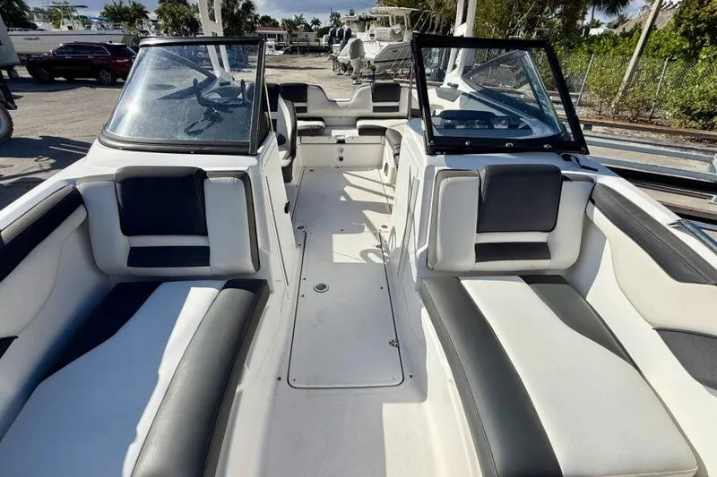 Slide: The Image of 2020 Yamaha Boats AR210 interior with sleek seating and open layout. - 34
