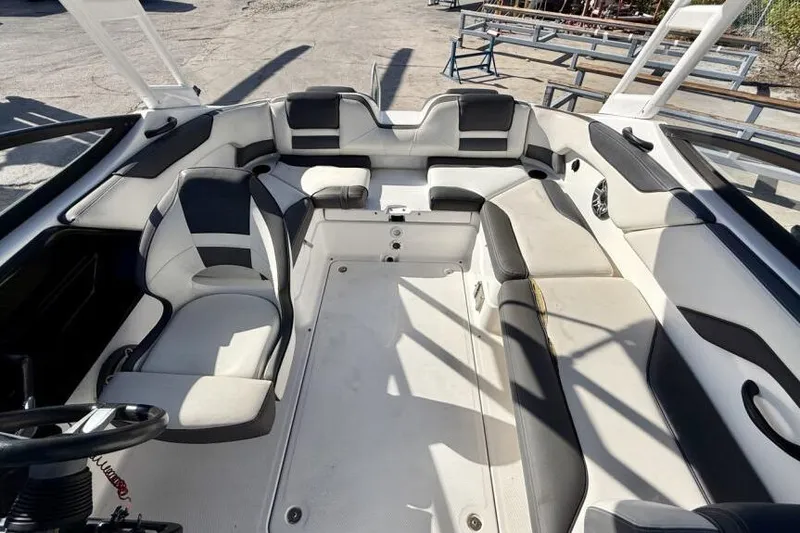 Slide: The Image of 2020 Yamaha Boats AR210 interior with spacious seating and modern design. - 41