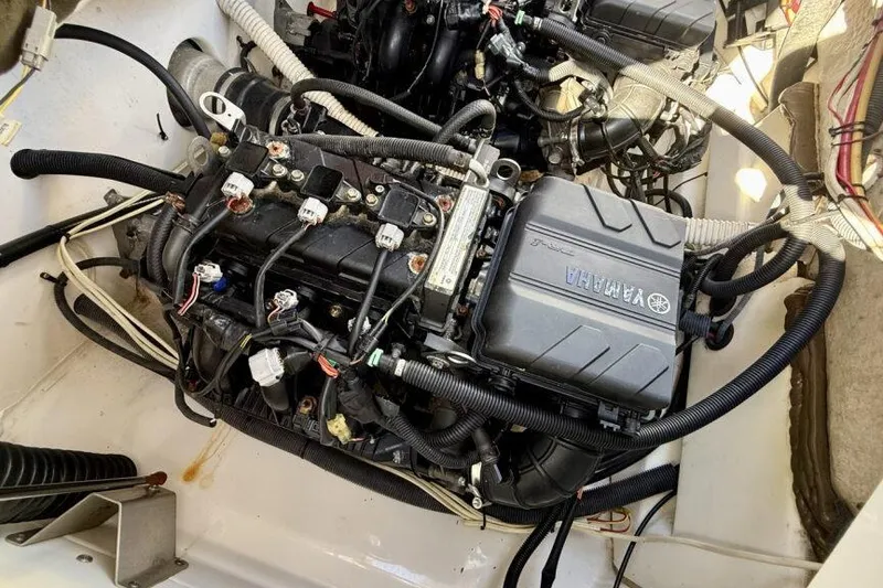 Slide: The Image of 2020 Yamaha AR210 boat engine compartment with visible wiring and components. - 46