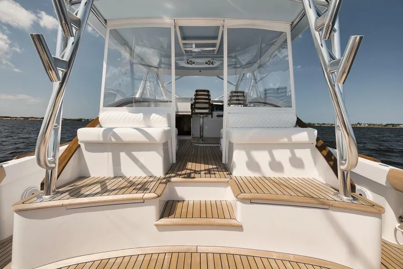 Slide: The Image of Luxurious 2024 Gamefisherman 49 yacht interior with teak decking and modern seating. - 16