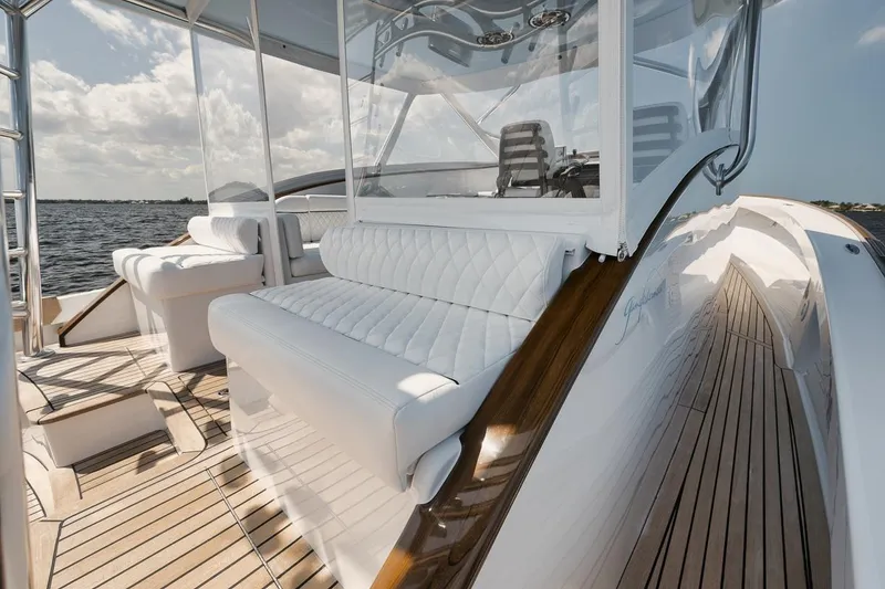 Slide: The Image of Luxurious 2024 Gamefisherman 49 yacht with elegant white seating and teak deck. - 26