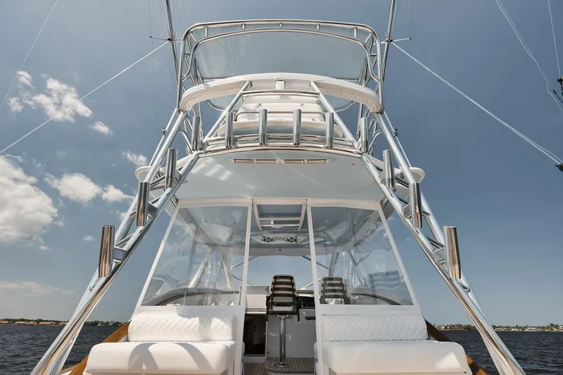 Slide: The Image of 2024 Gamefisherman 49 yacht with sleek design and spacious seating on open water. - 30