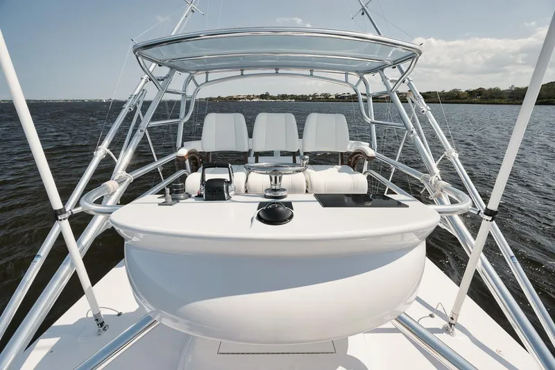 Slide: The Image of 2024 Gamefisherman 49 yacht helm with sleek design on open water. - 36