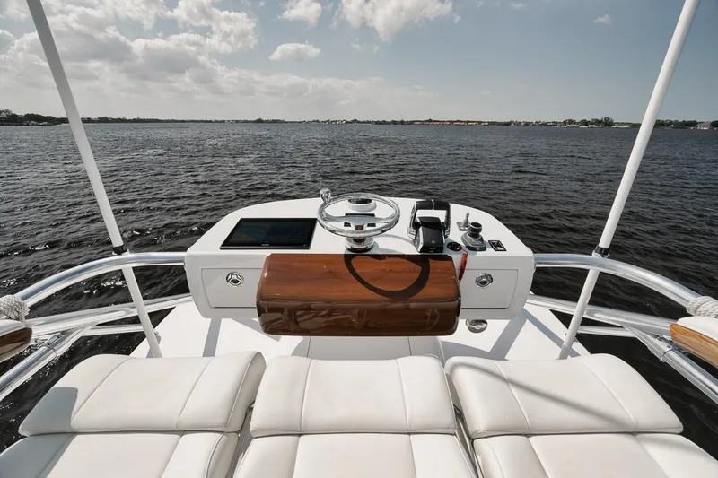 Slide: The Image of 2024 Gamefisherman 49 yacht helm with luxurious seating and ocean view. - 37