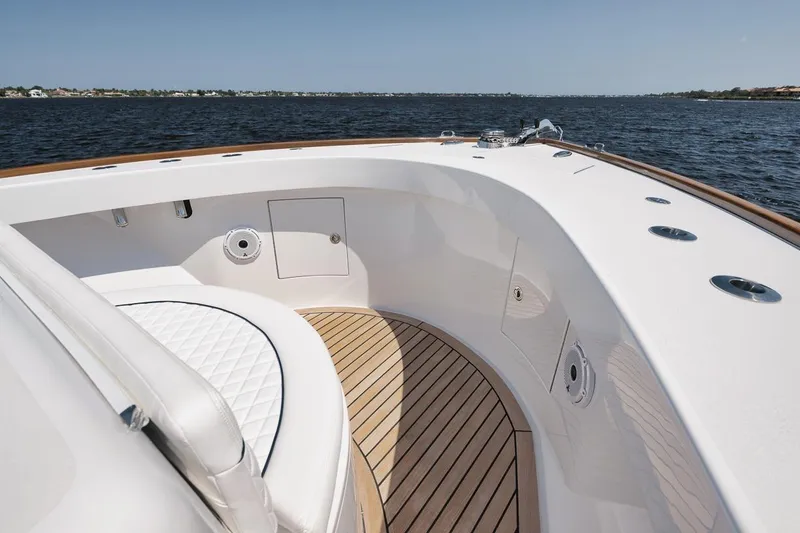 Slide: The Image of Luxurious 2024 Gamefisherman 49 yacht deck with white seating and wooden flooring. - 40