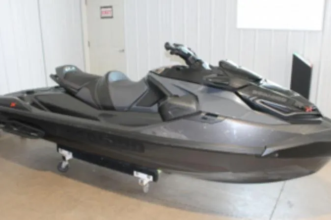 The Image of 2022 Sea-Doo RXT-X 300 Premium Triple Black jet ski in showroom. - 1