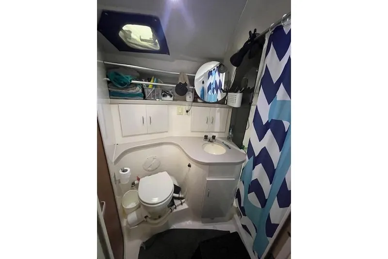 Slide: The Image of Bathroom interior of 1994 Mainship 40 Sedan Bridge with shower and storage. - 18