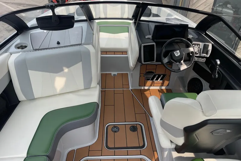Slide: The Image of 2023 Malibu Wakesetter 24 MXZ interior with modern dashboard and stylish seating. - 3
