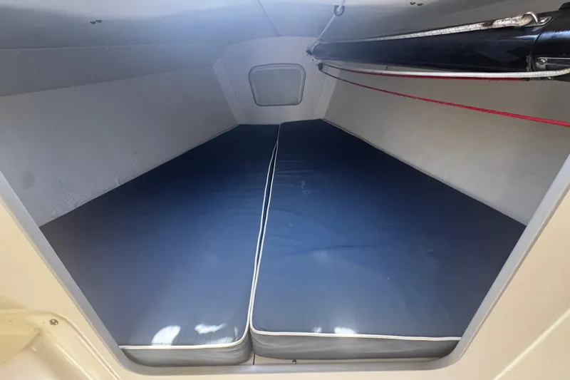 Slide: The Image of Interior cabin of 2003 J Boats J/105 sailboat with blue cushions. - 13